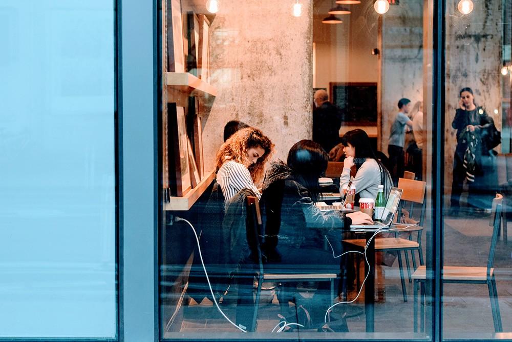 Female working and also drinking in the restaurant a
