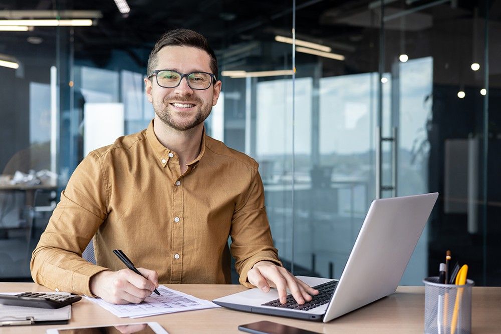 Man with smiling face doing his work